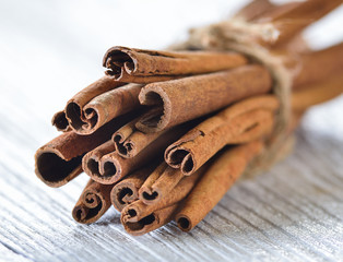 Cinnamon on white wood