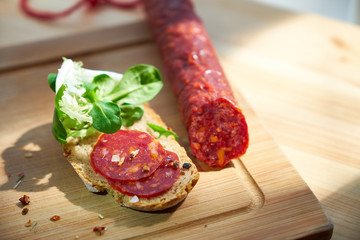 Salami with bread and salad