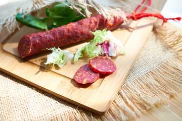 Salami with bread and salad