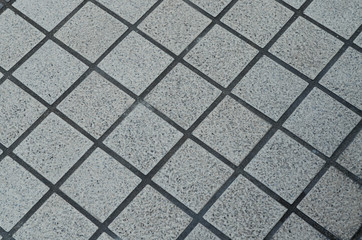 Grunge gray ceramic tile floor
