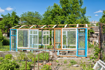 Construction of a greenhouse in the garden from scrap materials