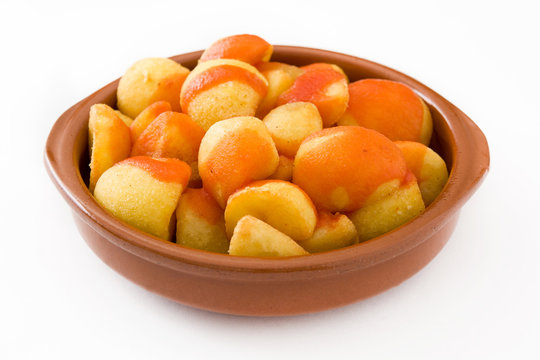 Patatas bravas in bowl isolated on white background

