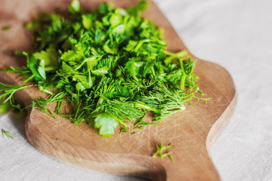 Fresh Herbs On A Wooden Chopping Board. Photos For Recipes.