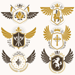 Vintage heraldry design templates, vector emblems created with bird wings, crowns, stars, armory and animal illustrations. Collection of vintage style symbols.