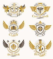 Obraz premium Vintage decorative heraldic vector emblems composed with elements like eagle wings, religious crosses, armory and medieval castles, animals. Collection of classy symbolic illustrations.