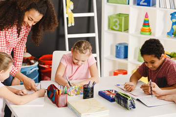 Children drawing during art class