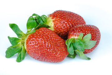 Ripe strawberry on white background.