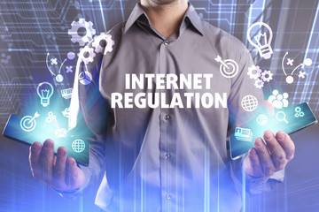 Business, Technology, Internet and network concept. Young businessman working on a virtual screen of the future and sees the inscription: Internet regulation