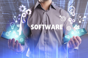 Business, Technology, Internet and network concept. Young businessman working on a virtual screen of the future and sees the inscription: Software