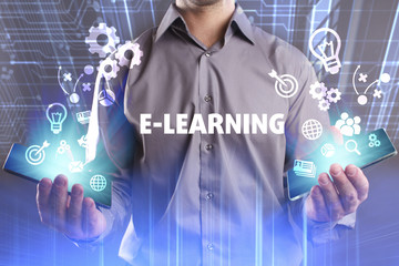 Business, Technology, Internet and network concept. Young businessman working on a virtual screen of the future and sees the inscription: E-learning