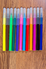 Multicolored flomatsery close-up laid out on the table. Stationery.