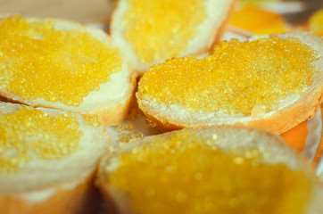 Sandwich of bread, butter and pike caviar. Close-up, selective focus.