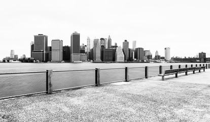 Manhattan skyline in cloudy day, black and white photography, view from Brooklyn Bridge Park, Pier 5, New York City, USA