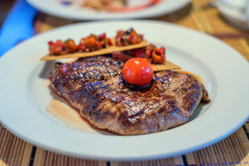 Grilled beef with tomato and bruschetta