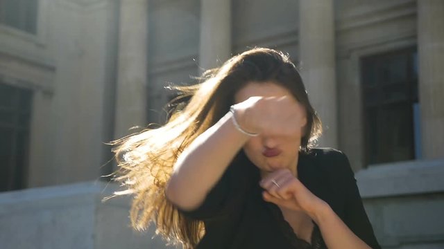 Closeup of young attractive woman provoking and punching in slow motion