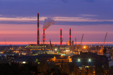 Chimneys of heating plant in Gdansk at sunset, Poland