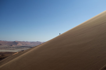 Fototapeta na wymiar One Person Climbing Up Big Daddy Dune, Desert Landscape, Namibia