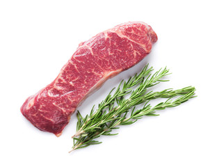 Raw striploin steak with rosemary