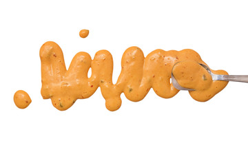 splashes, droplets and spilled russian dressing with a spoon. Blots of thousand island sauce and spoon dipped in sauce. isolated on white background. flat lay, top view