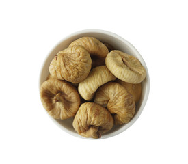 Figs in a bowl. Dried fruit with copy space for text. Top view. Figs isolated on white background