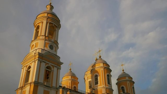 A view of the Vladimir cathedral against the sky in the evening at sunset. Saint Petersburg. Timelapse