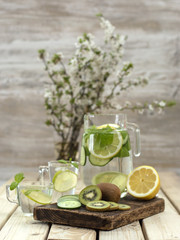 refreshing drink with lemon on a wooden board. 