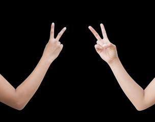 The right back and front side hand of the woman show Rock Paper Scissors sign for find the winners fair in the game. show scissors sign. isolated on black background.