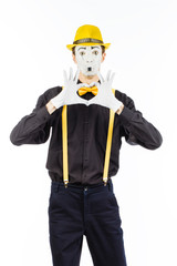 Portrait of a man, artist,clown, MIME. Shows a heart isolated on white background.