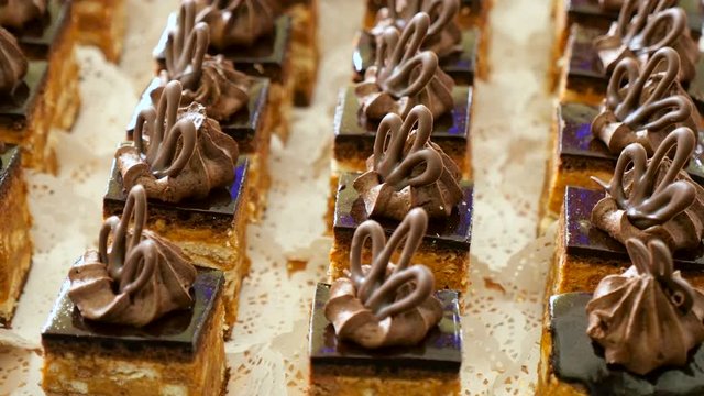chocolate cake with peanut cream and slices of nuts