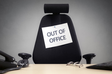 Business chair with out of office sign