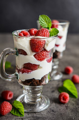 Delicious layered raspberry trifle in a glass jar