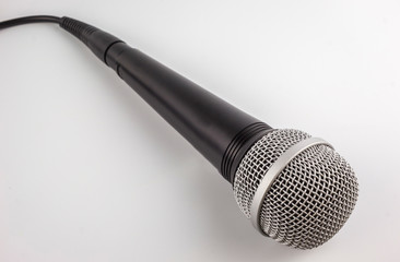 Microphone with a wire isolated on white background.