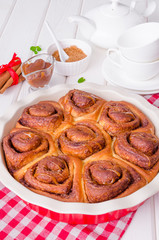 Cinnabon. Yeast buns with cinnamon and caramel sauce.