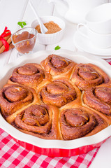 Cinnabon. Yeast buns with cinnamon and caramel sauce.
