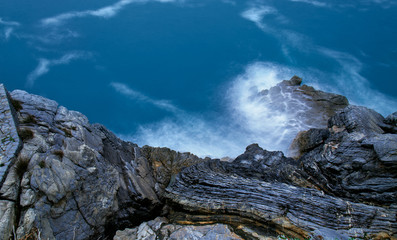 cliff on sea. Rocks and water. Top view