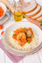 Fish stewed in tomato sauce with vegetables