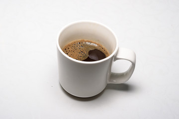 White cup of hot domestic coffee