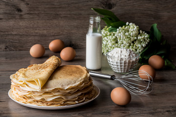 Delicious pancakes on wooden table