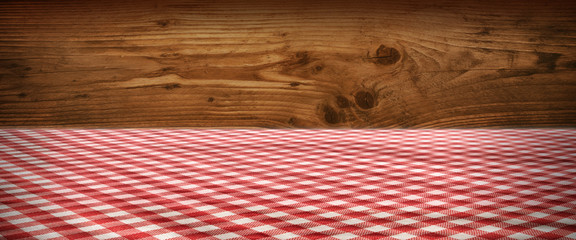 Tablecloth checkered in front of wooden wall
