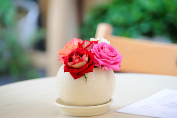Roses in a round vase