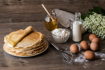 Delicious pancakes on wooden table