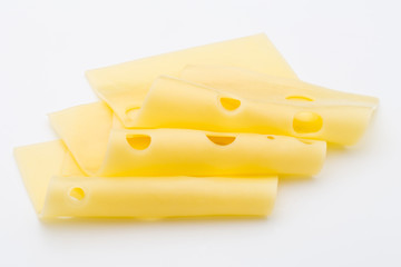 Cheese slices on white background cutout.