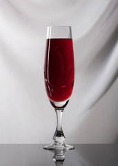 Wine. Glass of wine on gray background