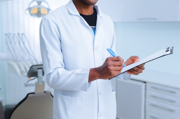 Black dentist in a dental clinic