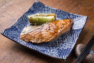 Japanese fish Teriyaki with Tsukemono Vegetable as close-up on a bowl