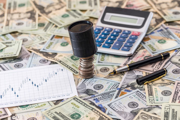 Fototapeta premium Business concept - business graphs with calculator and dollar. Top view.