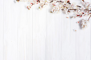 Spring white flowers on vintage wooden background
