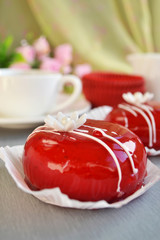 Blueberry yoghurt cake (mousse) with raspberry icing and white marshmallow ( flower). Festive dessert. Gourmet Raspberry Almond Fondant.