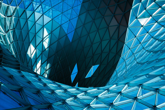 Structural glass facade of modern office building. Abstract architecture fragment.