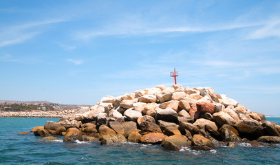 Breakwater / jetty for the Puerto San Jose Del Cabo harbor / marina under cirrus skies in Baja Mexico